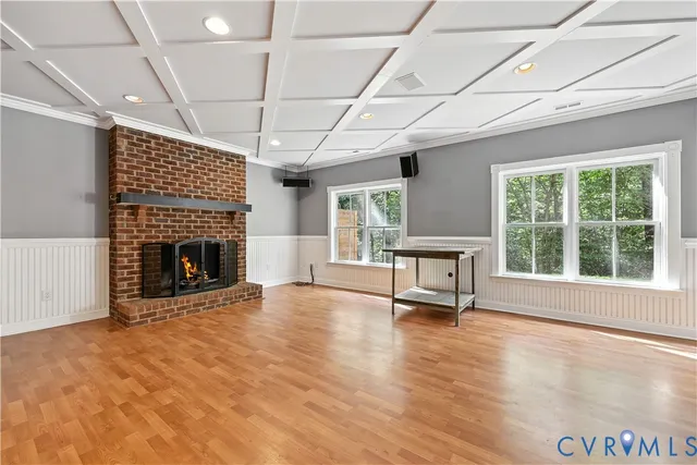 a kitchen with kitchen island a sink a stove and a window