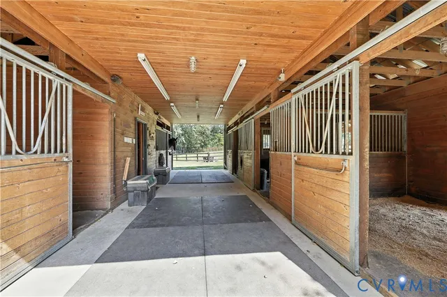 a view of a living room with bathroom