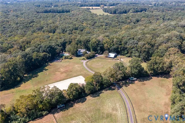 a view of a swimming pool with a yard and mountain view