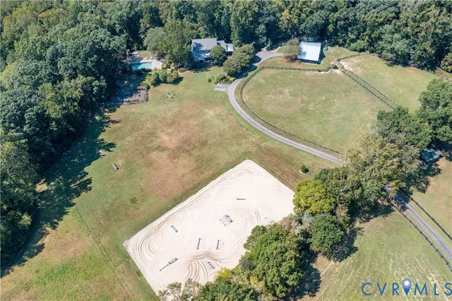 a view of a swimming pool with a yard