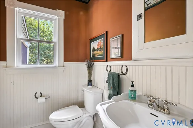 a living room with furniture bathtub and a table