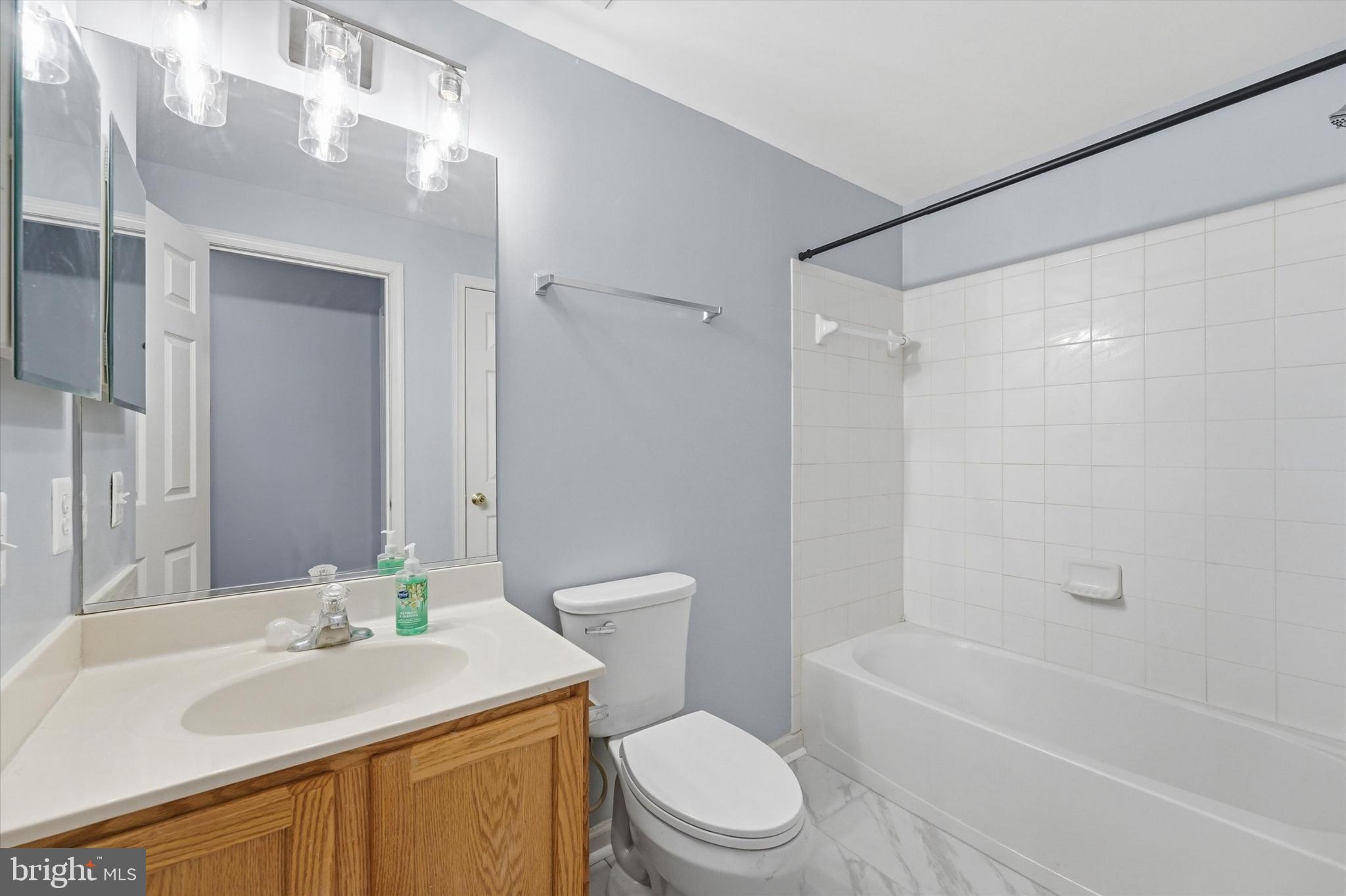 24 Overbrook Road Ranson, WV 25438 - Photo 18 of 21 a bathroom with a sink a toilet and shower