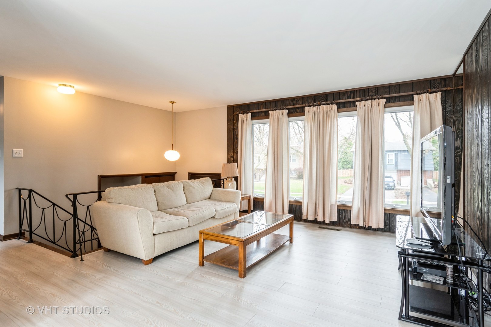 360 Galahad Road Bolingbrook, IL 60440 - Photo 3 of 20 a living room with furniture and a flat screen tv