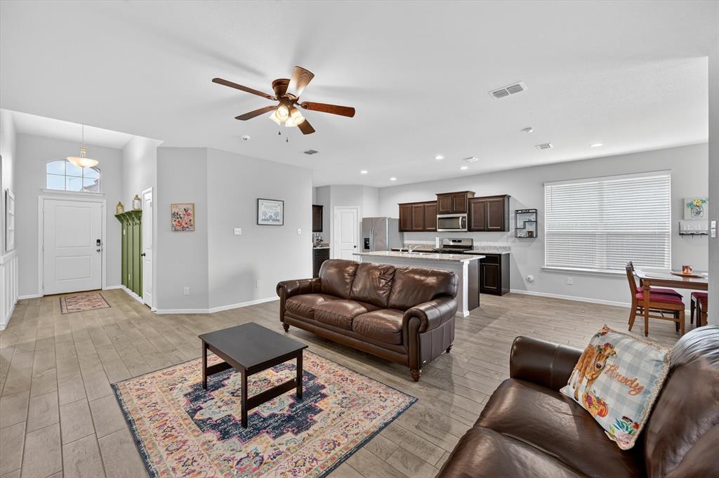 9604 Cherryville Road Fort Worth, TX 76108 - Photo 5 of 40 Open-concept living area featuring wood-finish flooring, a ceiling fan, and recessed lighting