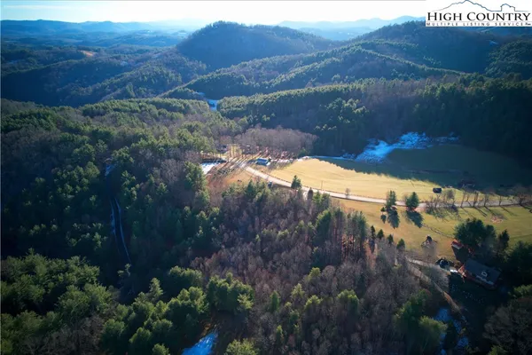 a view of a street with a yard