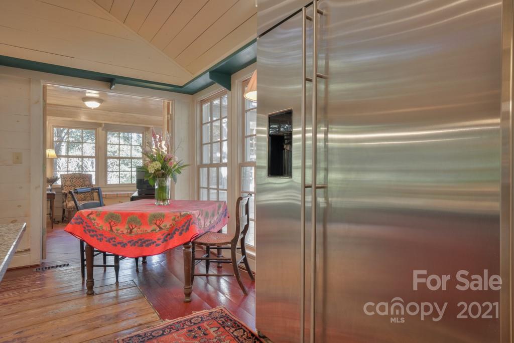 315 North Campbell Road Landrum, SC 29356 - Photo 14 of 40 a view of a dining room with furniture window and wooden floor