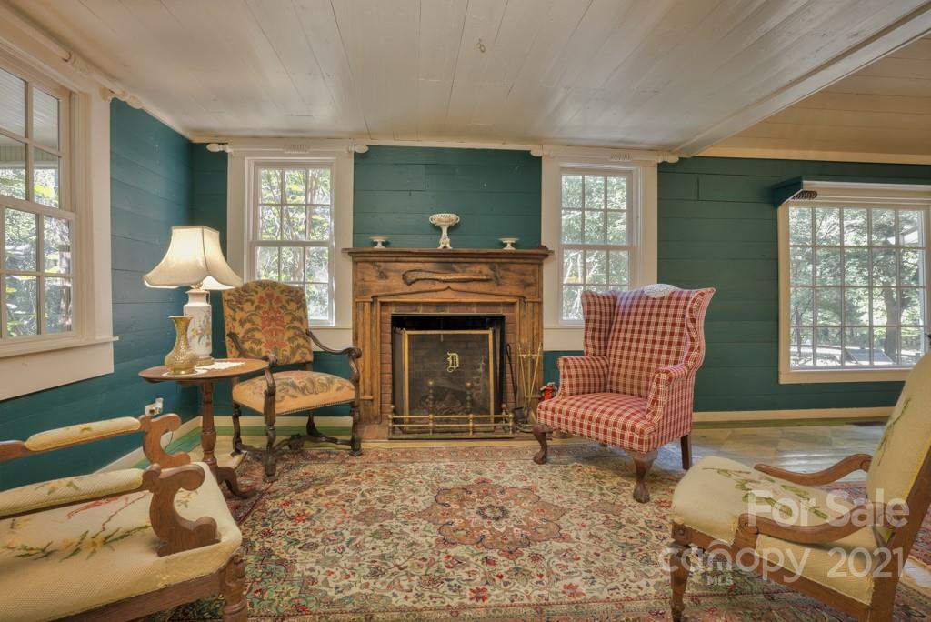 315 North Campbell Road Landrum, SC 29356 - Photo 17 of 40 a living room with furniture and a fireplace