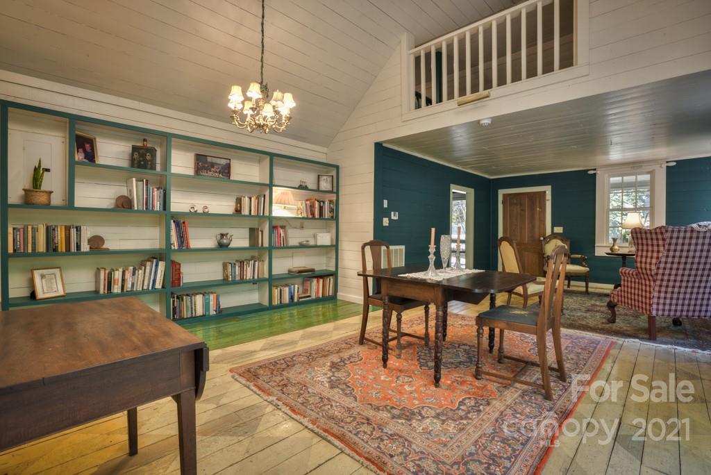 315 North Campbell Road Landrum, SC 29356 - Photo 19 of 40 a living room with furniture a rug and a chandelier