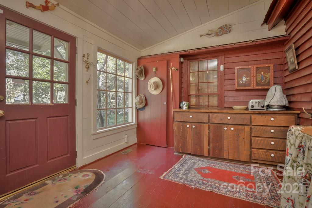 315 North Campbell Road Landrum, SC 29356 - Photo 22 of 40 a spacious bedroom with a bed and wooden floor
