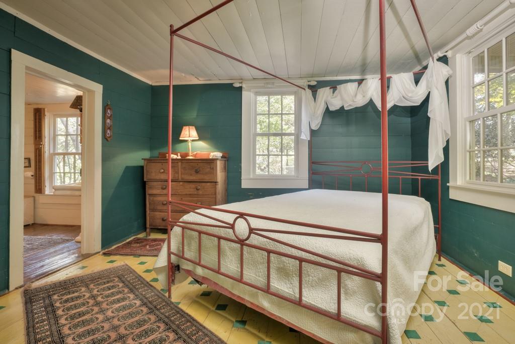 315 North Campbell Road Landrum, SC 29356 - Photo 24 of 40 a bedroom with a bed table and window