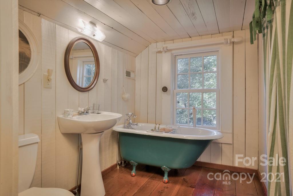 315 North Campbell Road Landrum, SC 29356 - Photo 27 of 40 a bathroom with a sink and mirror