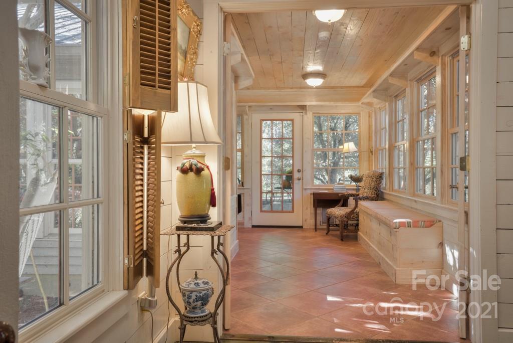 315 North Campbell Road Landrum, SC 29356 - Photo 28 of 40 a view of a entryway with furniture and floor to ceiling window