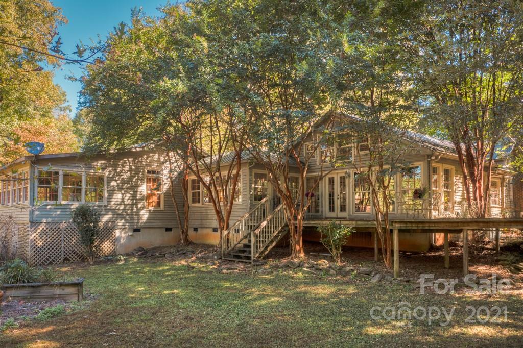 315 North Campbell Road Landrum, SC 29356 - Photo 3 of 40 a backyard of a house with table and chairs