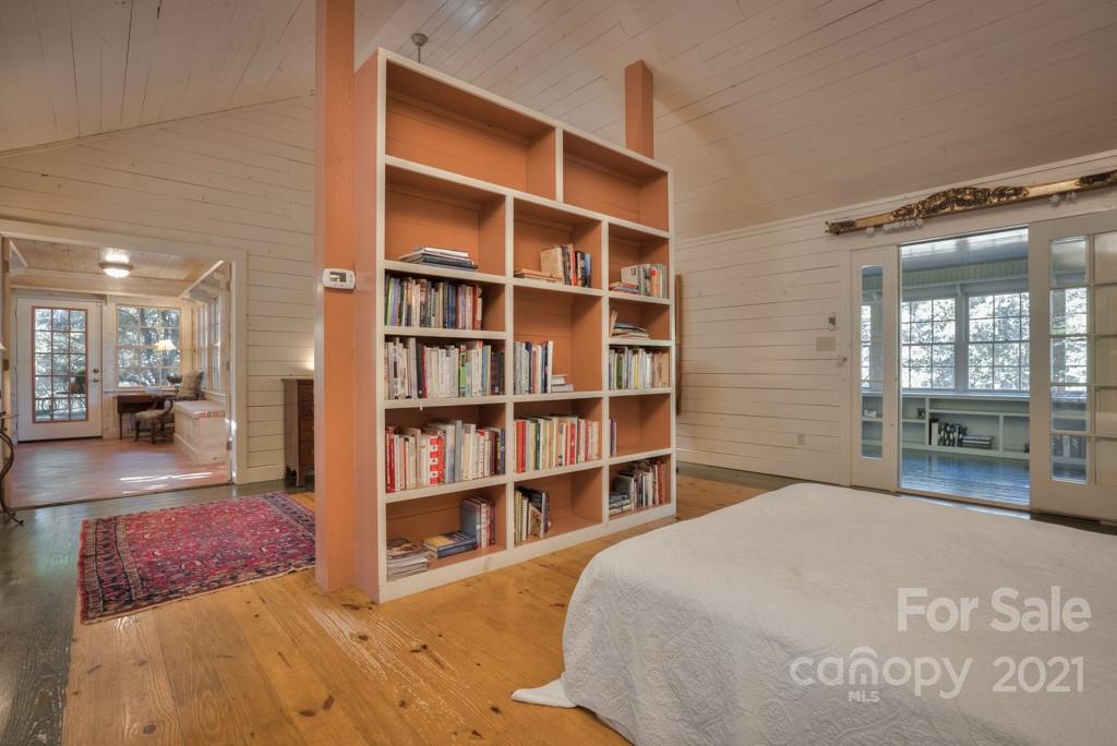 315 North Campbell Road Landrum, SC 29356 - Photo 33 of 40 a bedroom with a bed and a book shelf