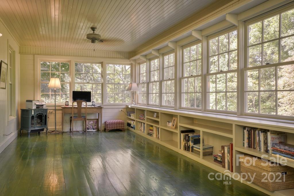 315 North Campbell Road Landrum, SC 29356 - Photo 36 of 40 a living room with furniture large windows open kitchen view
