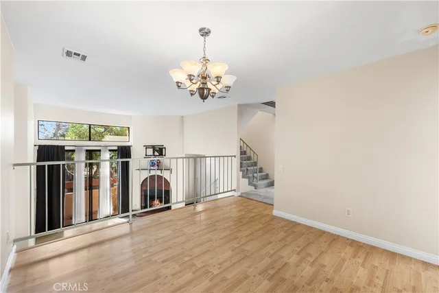 a view of a livingroom with washer and dryer