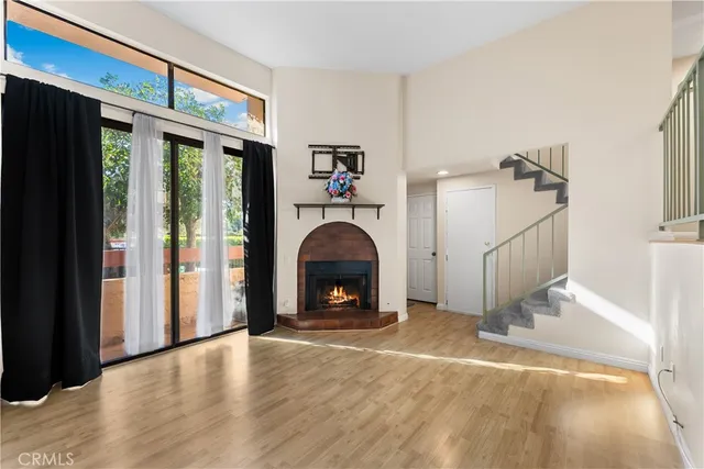 a view of a livingroom with an empty space and a fireplace