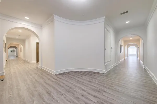 a view of a room with wooden floor