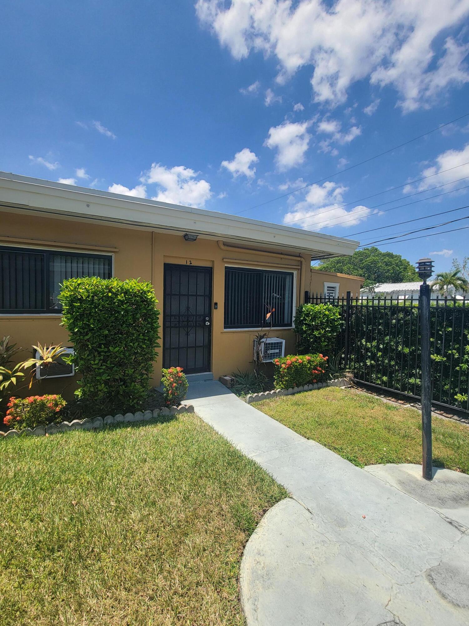 1845 Pembroke Road, Unit 212 Hollywood, FL 33020 - Photo 2 of 10 a view of a house with backyard and sitting area