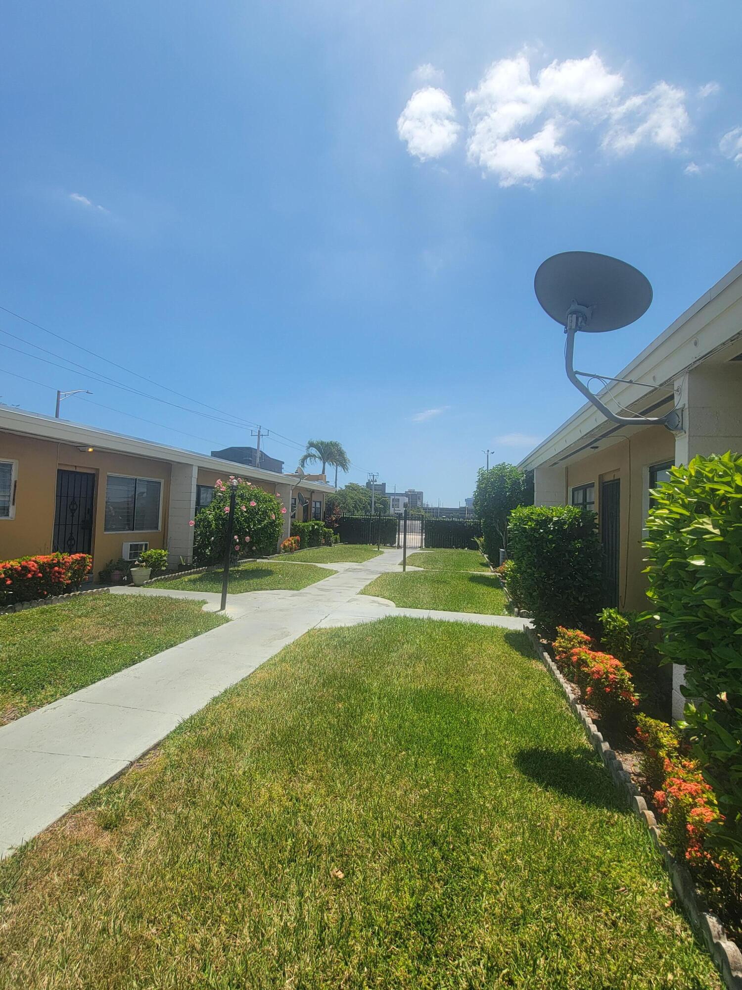 1845 Pembroke Road, Unit 212 Hollywood, FL 33020 - Photo 3 of 10 a view of a backyard with swimming pool