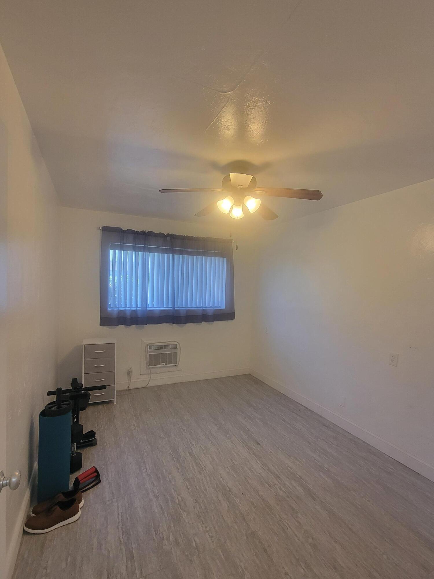 1845 Pembroke Road, Unit 212 Hollywood, FL 33020 - Photo 8 of 10 a view of a livingroom with furniture and a window