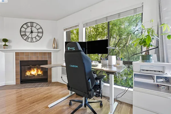 a workspace with furniture and a fireplace
