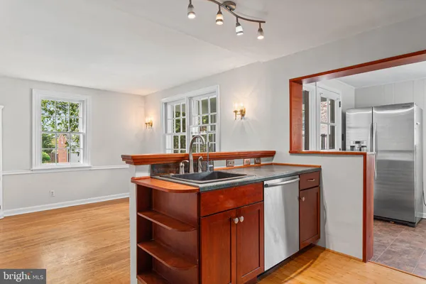 a kitchen with a sink and cabinets