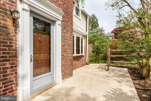 a backyard of a house with yard and outdoor seating