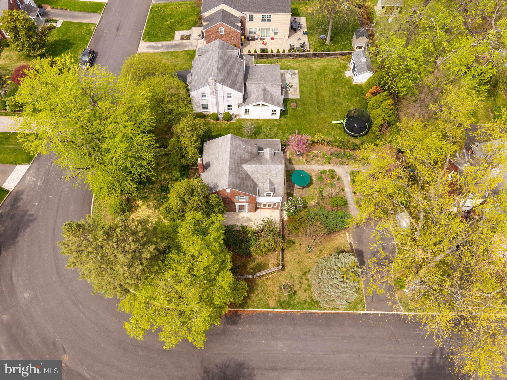 201 Glendalough Road Erdenheim, PA 19038 - Photo 45 of 50 Lush greenery surrounds a cozy home.