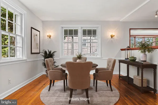 a view of a dining room with furniture window and wooden floor
