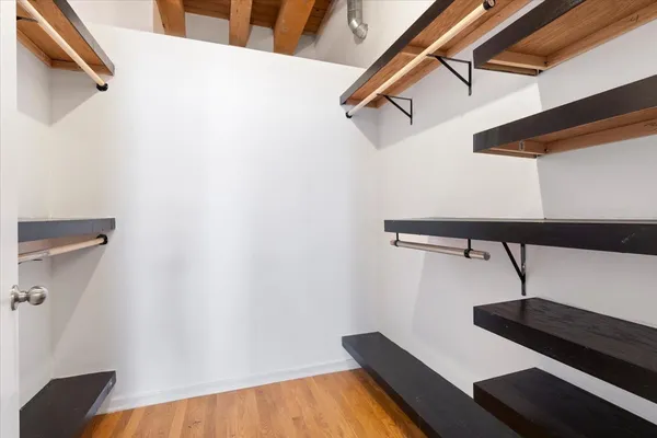 a view of a room with racks on the wall