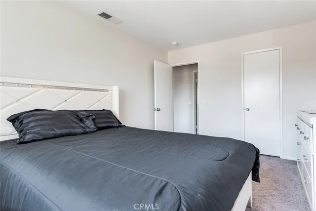 a bedroom with a bed and closet