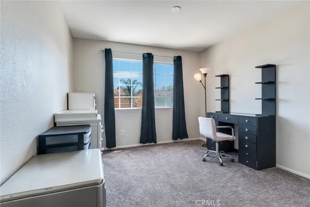 a view of a workspace with furniture