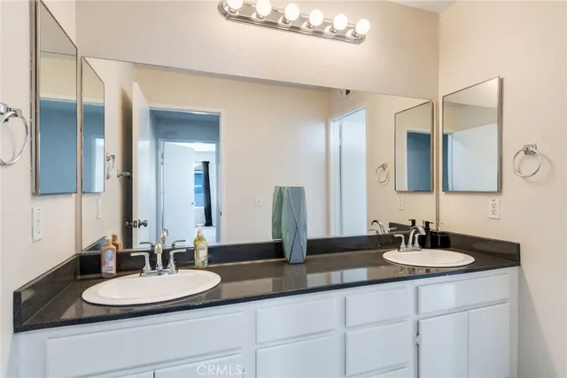 a bathroom with a toilet a sink and a shower