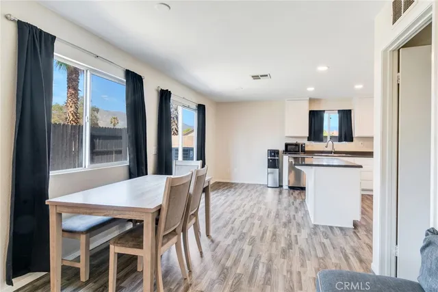 a kitchen with a table and chairs in it