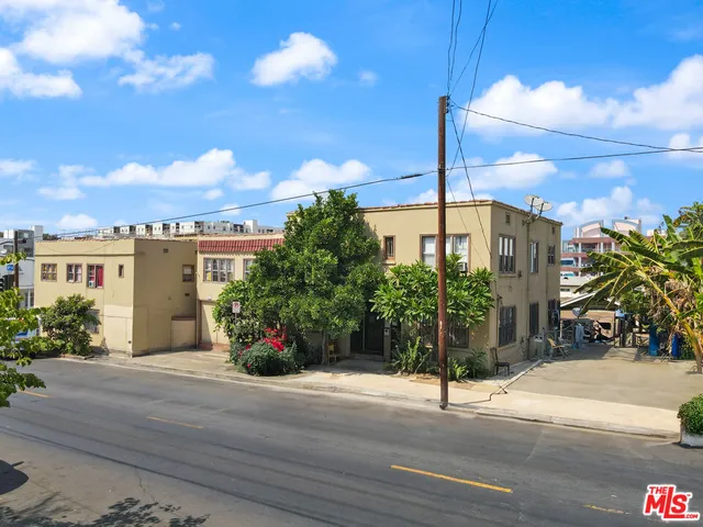 a view of a street with a building in the background