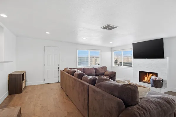 a living room with furniture and a flat screen tv
