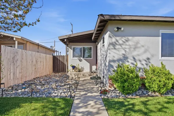 a front view of a house with garden