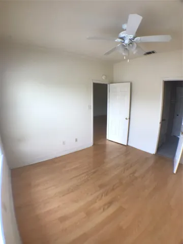 a view of a balcony with wooden floor