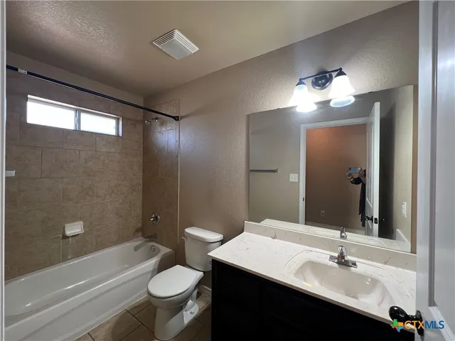 a bathroom with a sink double vanity and a mirror