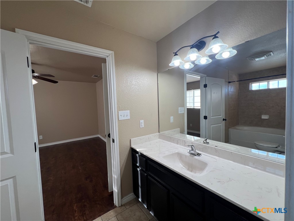 1105 Grace Point Drive Killeen, TX 76549 - Photo 23 of 25 a bathroom with a sink double vanity and a mirror