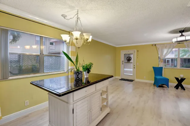 a room with table and chairs