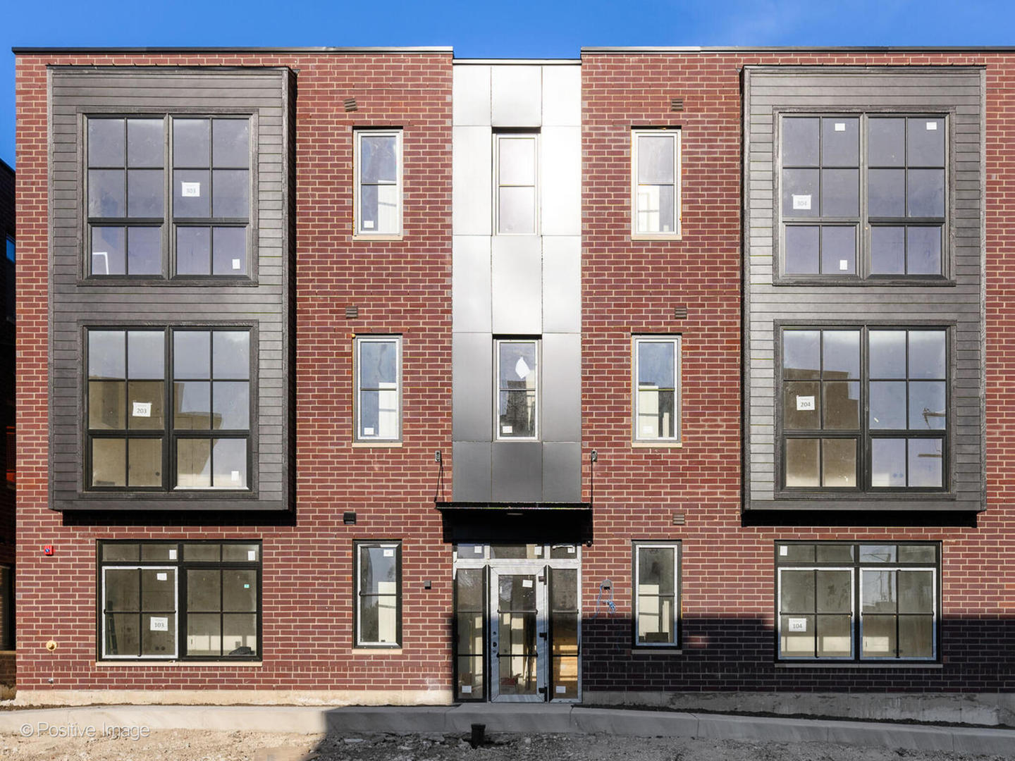 a front view of a multi story residential apartment building