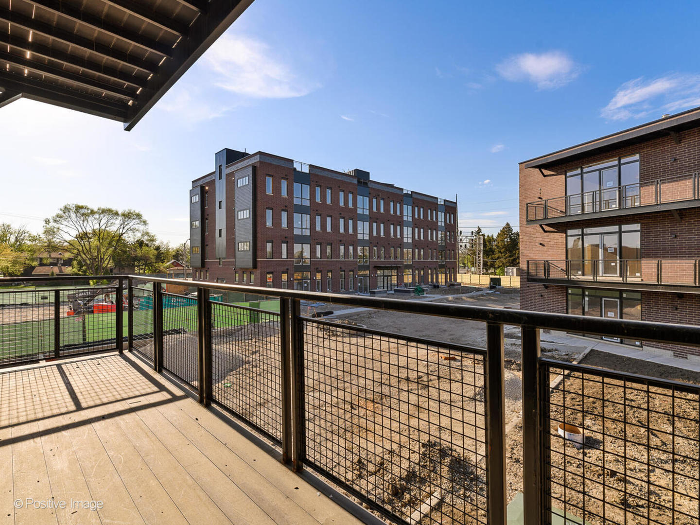 8308 West Center Avenue, Unit 303 River Grove, IL 60171 - Photo 19 of 24 a view of balcony with a couple of cars parked in front of it