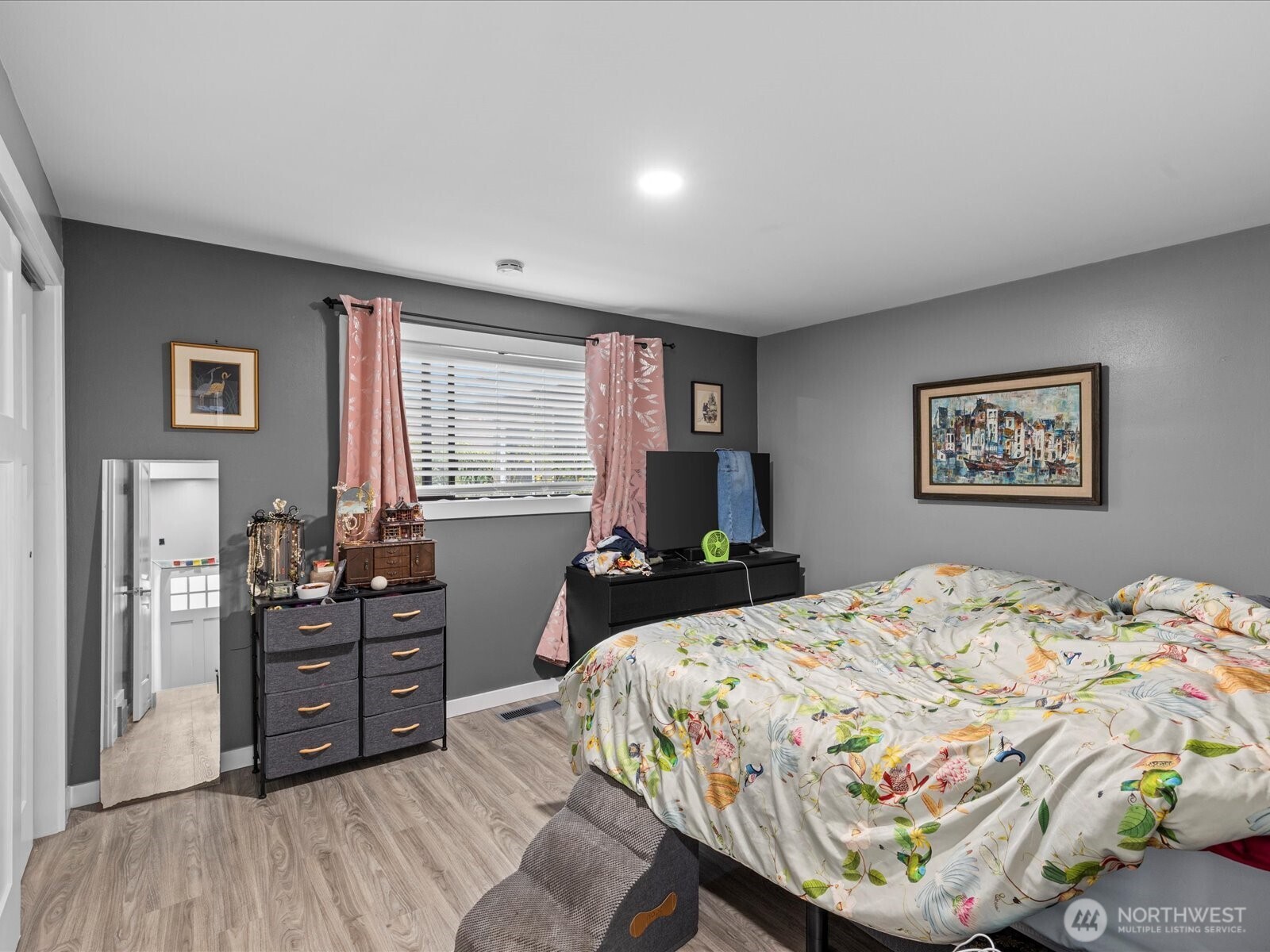 7138 47th Avenue Southwest Seattle, WA 98136 - Photo 11 of 20 a bedroom with a bed and wooden floor