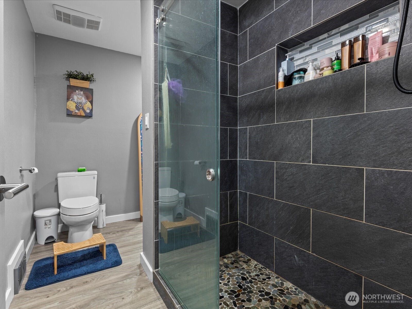 7138 47th Avenue Southwest Seattle, WA 98136 - Photo 12 of 20 a bathroom with a toilet and a shower