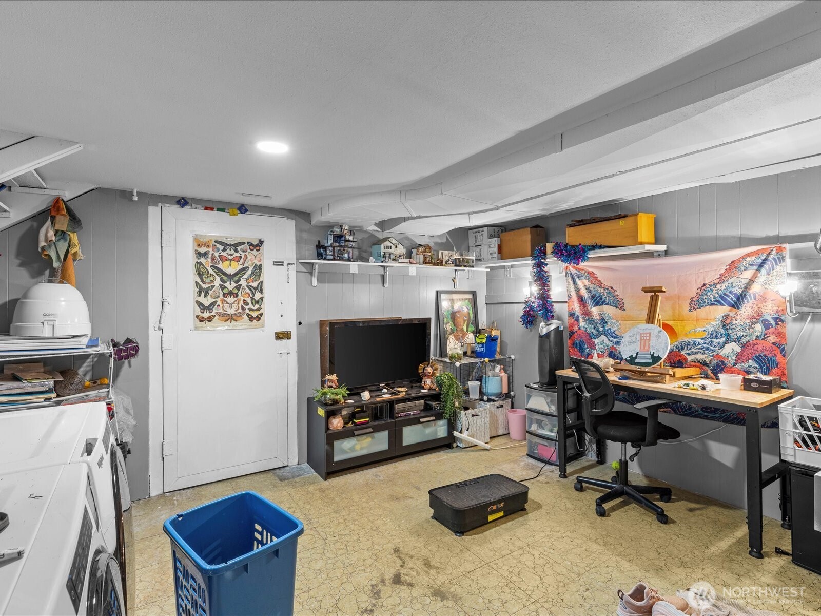 7138 47th Avenue Southwest Seattle, WA 98136 - Photo 16 of 20 a view of a workspace with furniture and a window