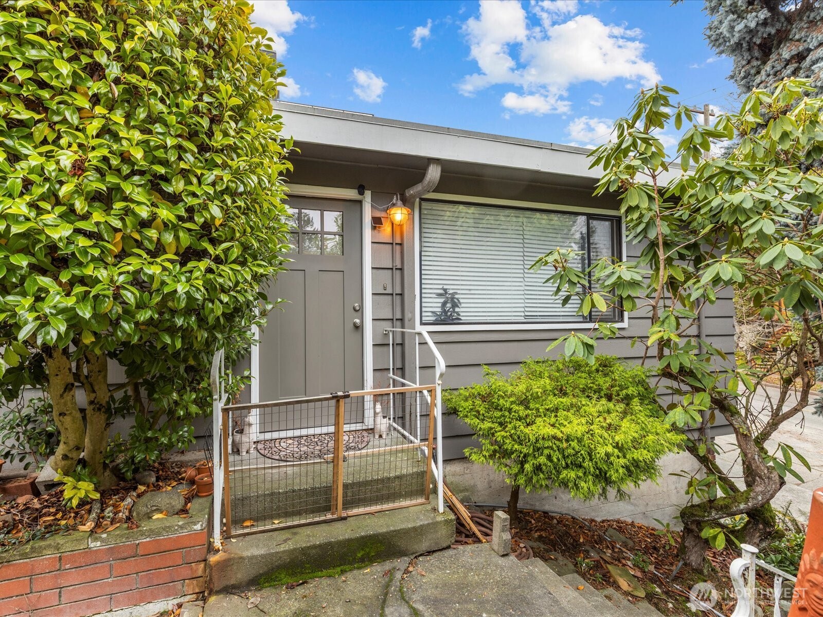 7138 47th Avenue Southwest Seattle, WA 98136 - Photo 20 of 20 a yellow house with outdoor space