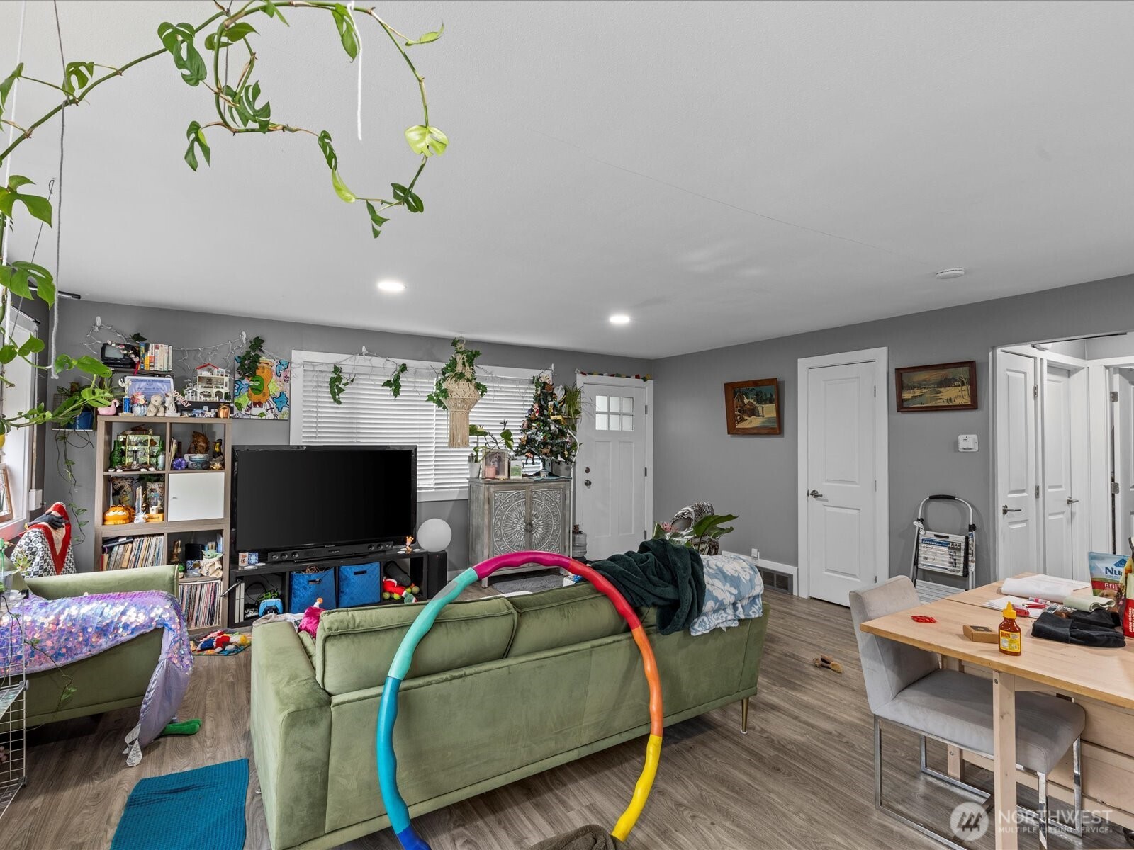 7138 47th Avenue Southwest Seattle, WA 98136 - Photo 4 of 20 a living room with furniture and a flat screen tv