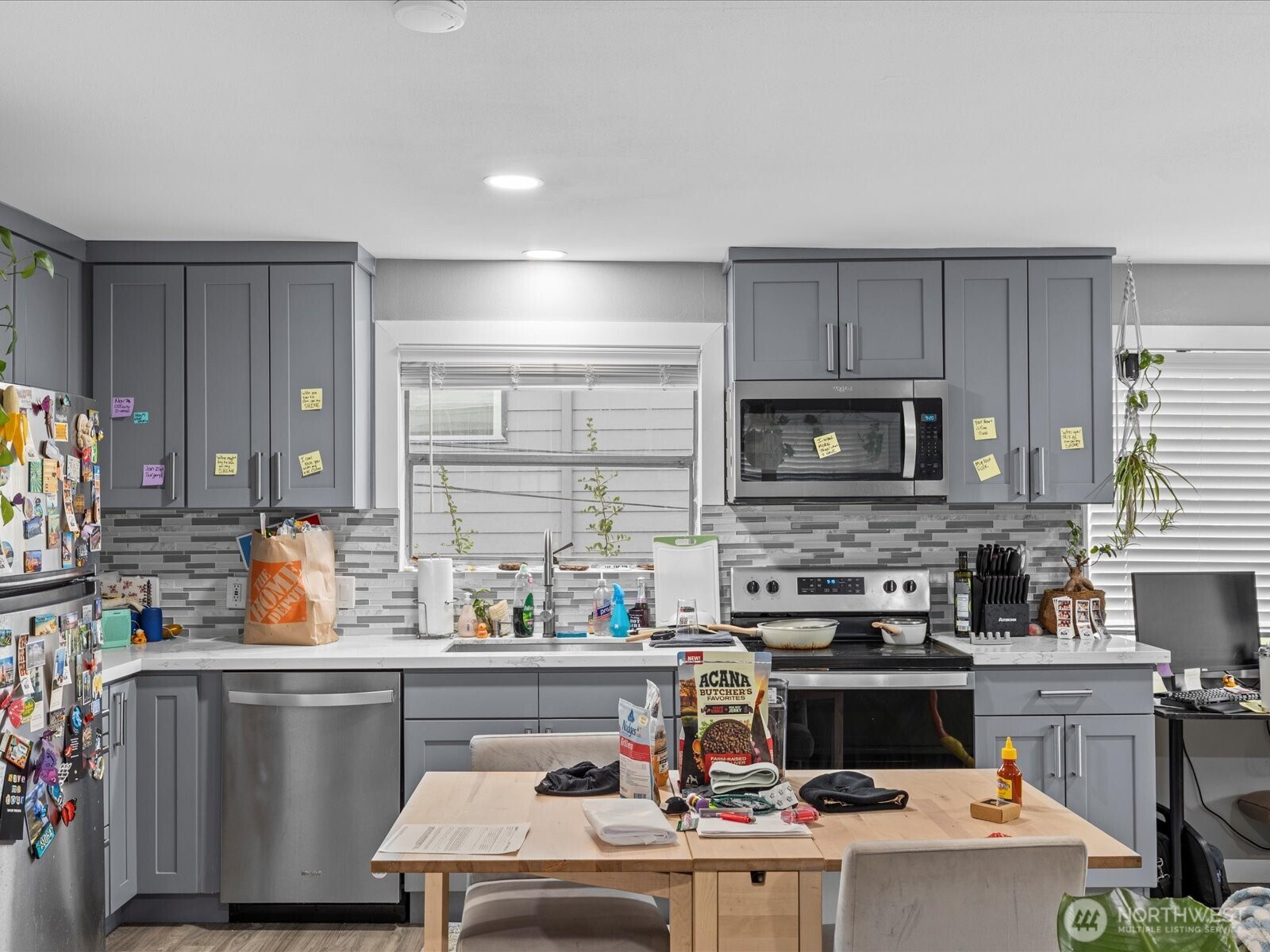 7138 47th Avenue Southwest Seattle, WA 98136 - Photo 9 of 20 a kitchen with a sink a stove and cabinets